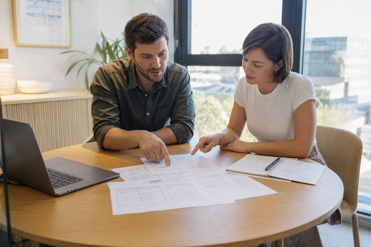 Client discussing landing page goals with a designer